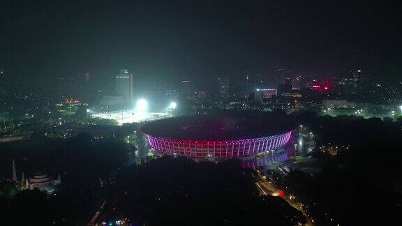 夜间照亮雅加达市著名的主体育场4k印尼航拍全景图