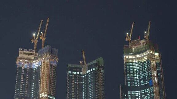 4K时光流逝:高层摩天大楼现代城市商务区背景夜景釜山韩国城市全景