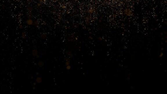 金色闪闪发光的粒子落在干净的黑色背景无缝循环动画复制空间背景
