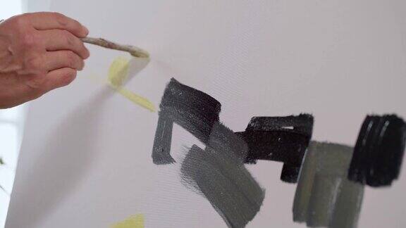 女艺术家用画笔在画布上作画画特写抽象绘画慢动作