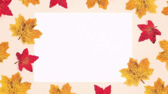 白色的文字和秋叶周围出现在米色的背景停止运动