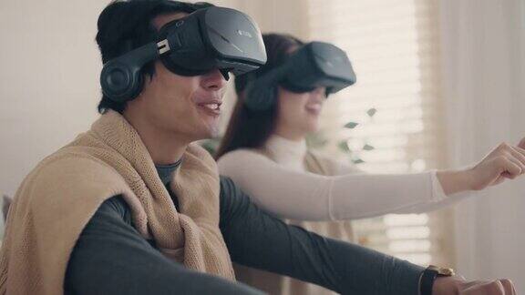 虚拟世界:幸福的亚洲夫妇玩虚拟现实耳机
