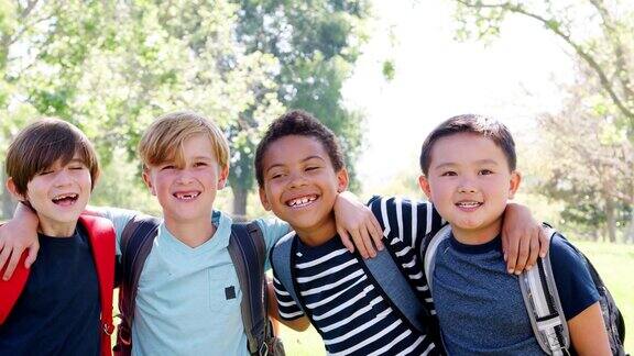 慢动作拍摄的一组年轻男孩和朋友在公园里的肖像
