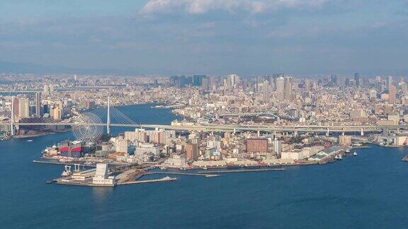 大阪时光流逝;鸟瞰图夜景大阪城市摩天轮地标城市的生活概念