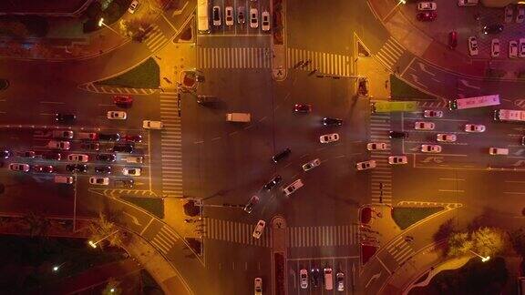 夜间照明青岛市市中心街道十字路口高空俯视4k中国全景
