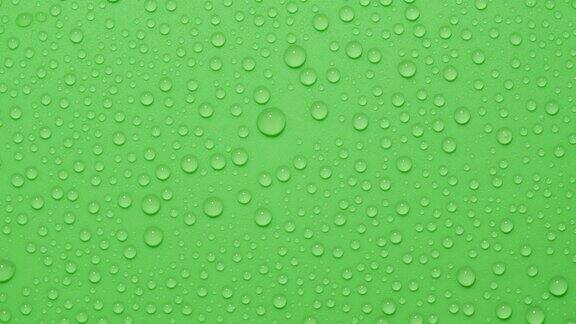 特写透明水滴纹理旋转绿色色度键背景