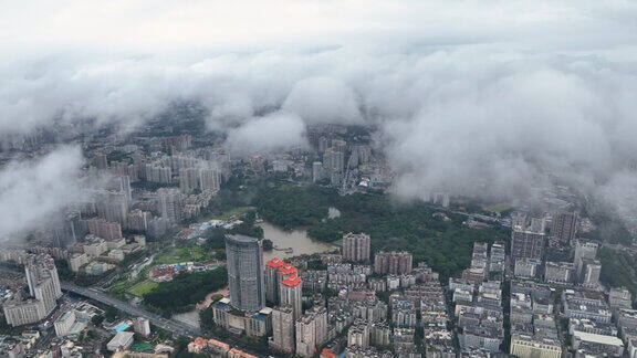 航拍城市云海下的广州天河公园